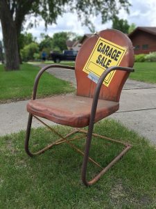 Chair with a garage sale sign on it
