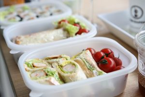 lunch boxes with food in them