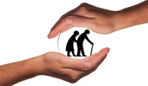 Hands showing care towards the elderly