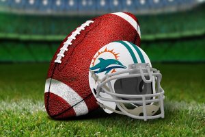 A Miami dolphins helmet and a ball