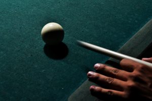 Person playing pool.
