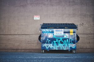 dumpster in a street - ways to handle junk removal