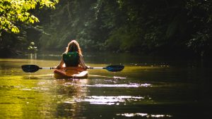 things to do in Palm Bay FL- a girl kayaking on the river