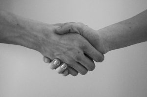 Shaking hands to handle to disputes with movers