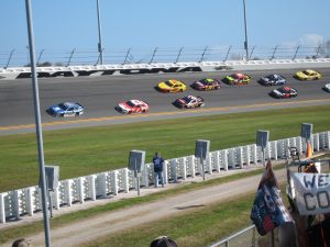 A race track full of brightly colored race cars