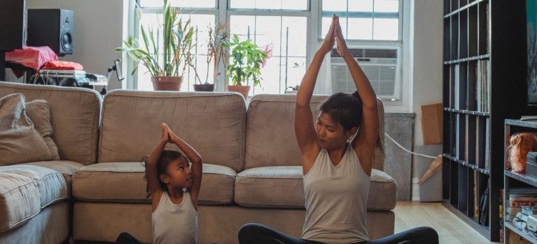 mother and daughter donig yoga