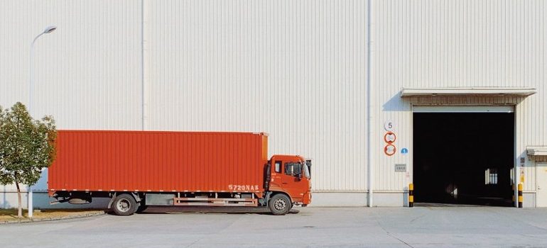 a moving truck entering a warehouse