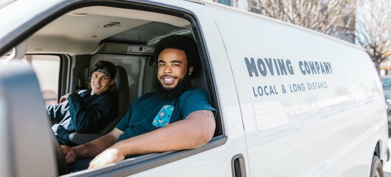 two men in a van are part of residential movers Lake City FL