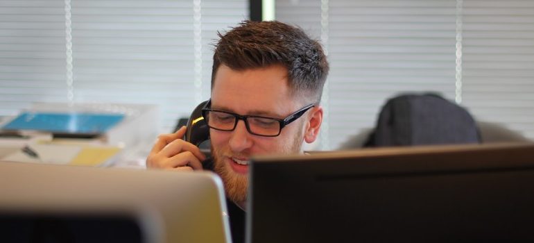 a call center agent, answering the phone