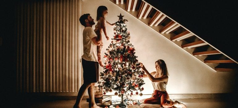 Family decorating the Christmas tree