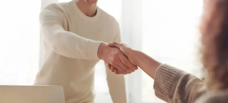 A man and a woman shaking hands