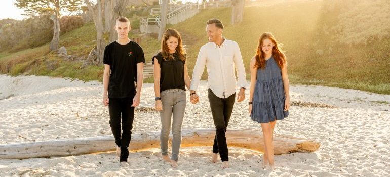 Family walking on the beach - Deciding beetween living in Miramar vs. Pembroke Pines