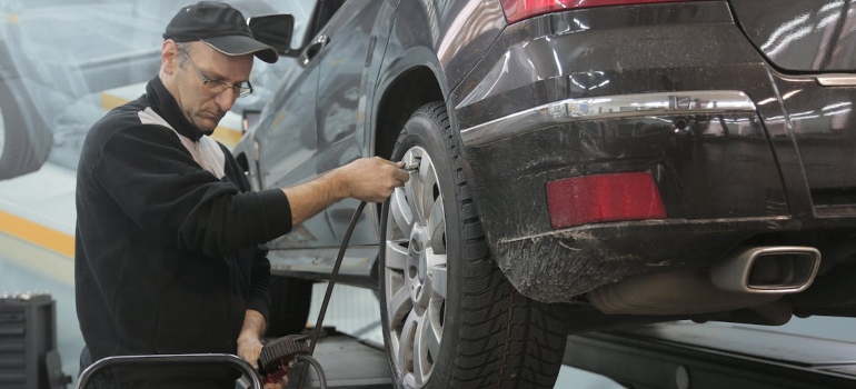 a mechanic checking a car